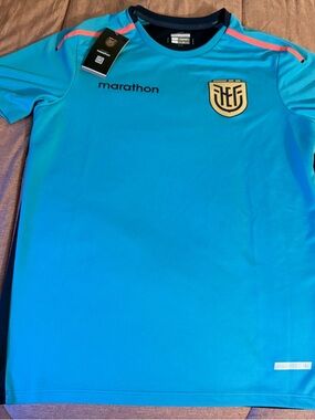 Marathon Teal Athletic Jersey with Crest